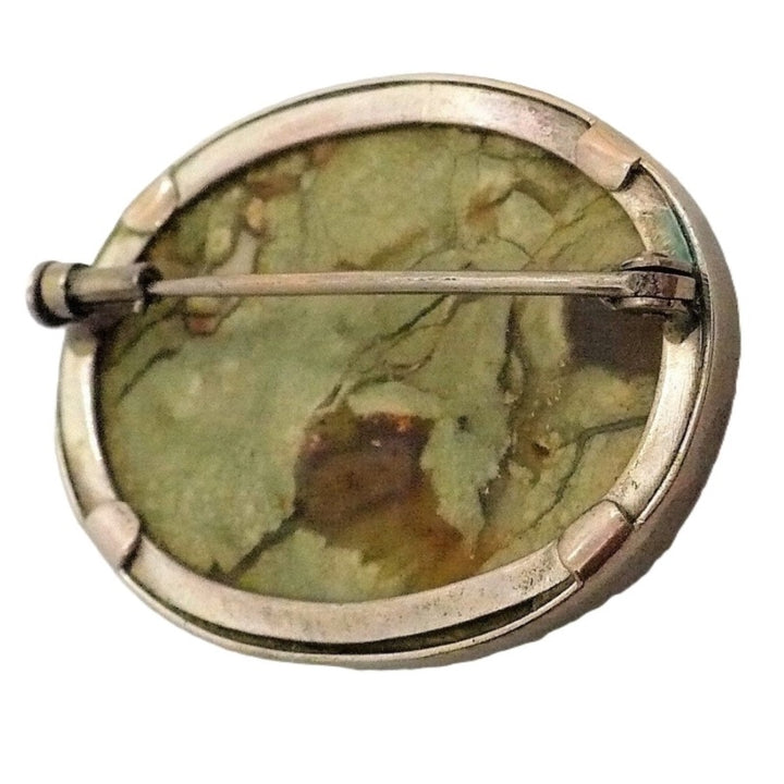 Brooch.