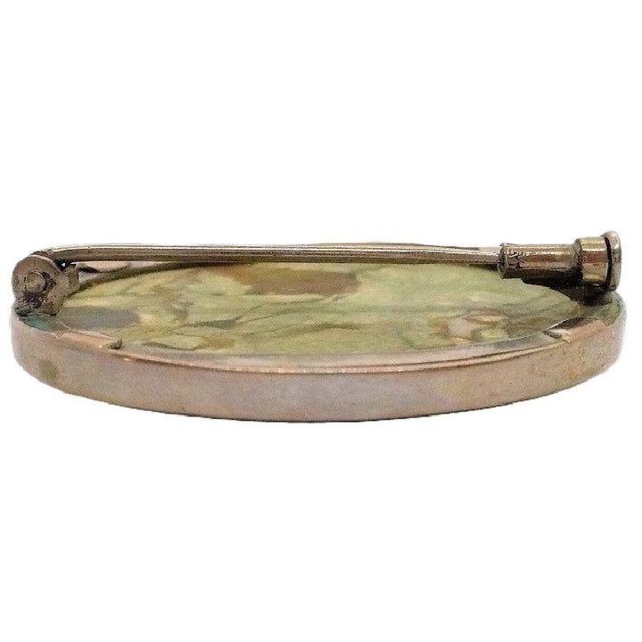 Brooch.