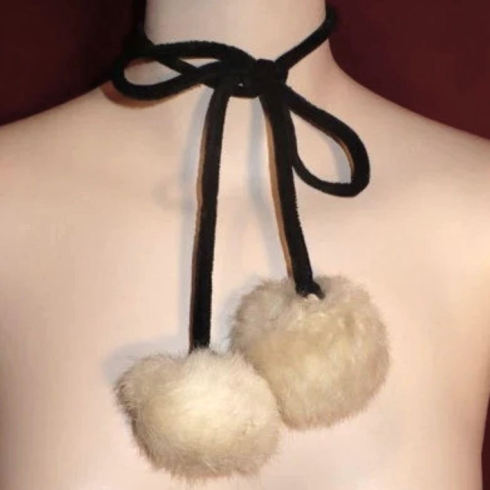 Fur ball necklace.