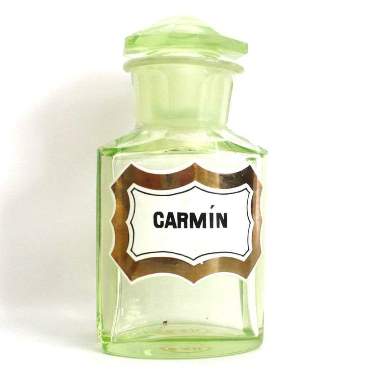 Uranium glass apothecary bottle under regular light.