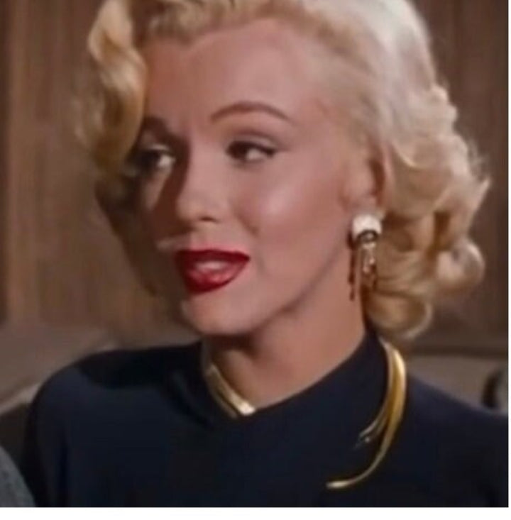Marilyn Monroe wearing goldtone fashion necklaces in Gentlemen Prefer Blondes.