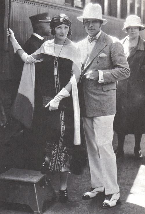 Rudolph Valentino wife wearing scarf.