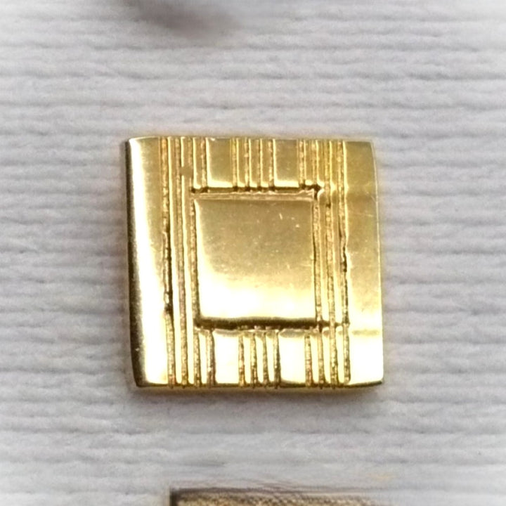 Vintage tie tack with chain and bar.