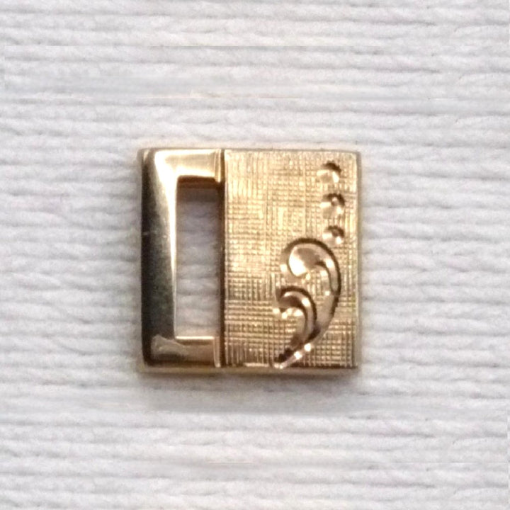 Vintage tie tack with chain and bar.