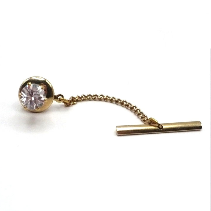 Vintage tie tack with chain and bar.