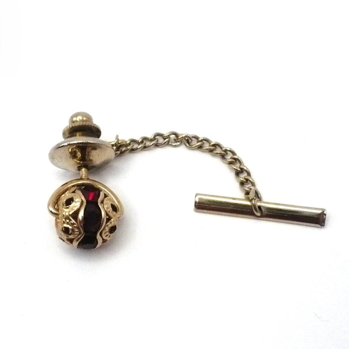 Vintage tie tack with chain and bar.