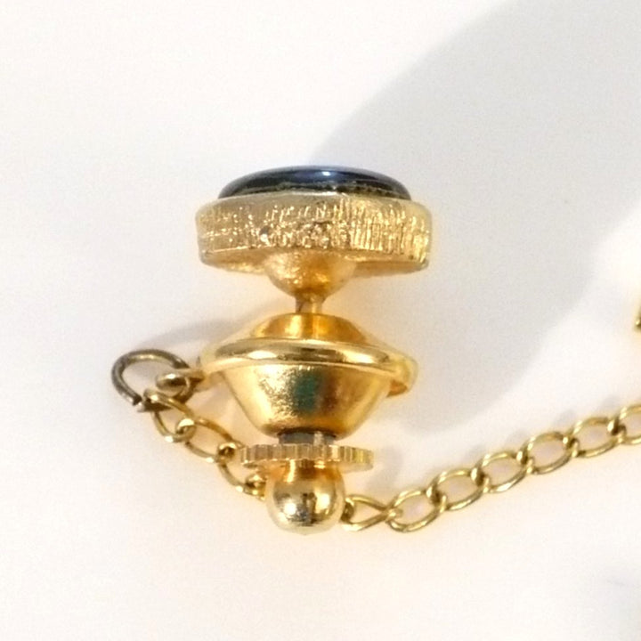 Vintage tie tack with chain and bar.