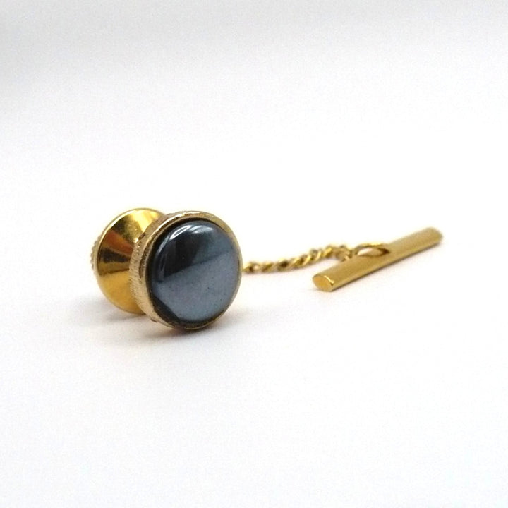 Vintage tie tack with chain and bar.