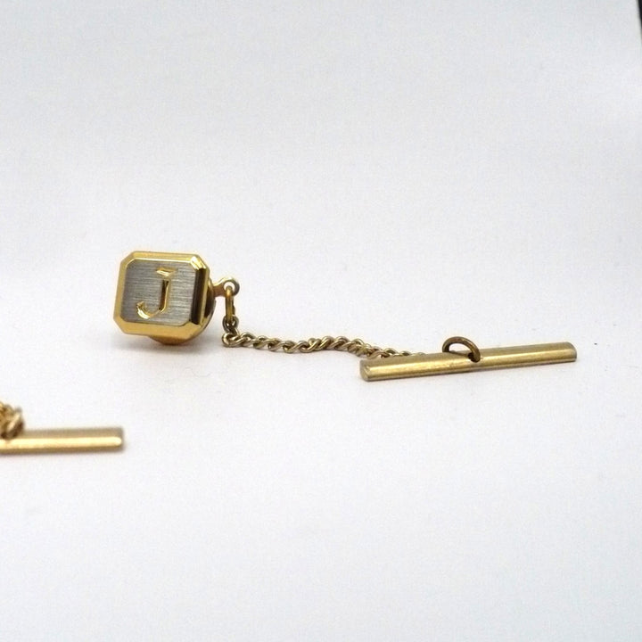 Vintage tie tack with chain and bar.