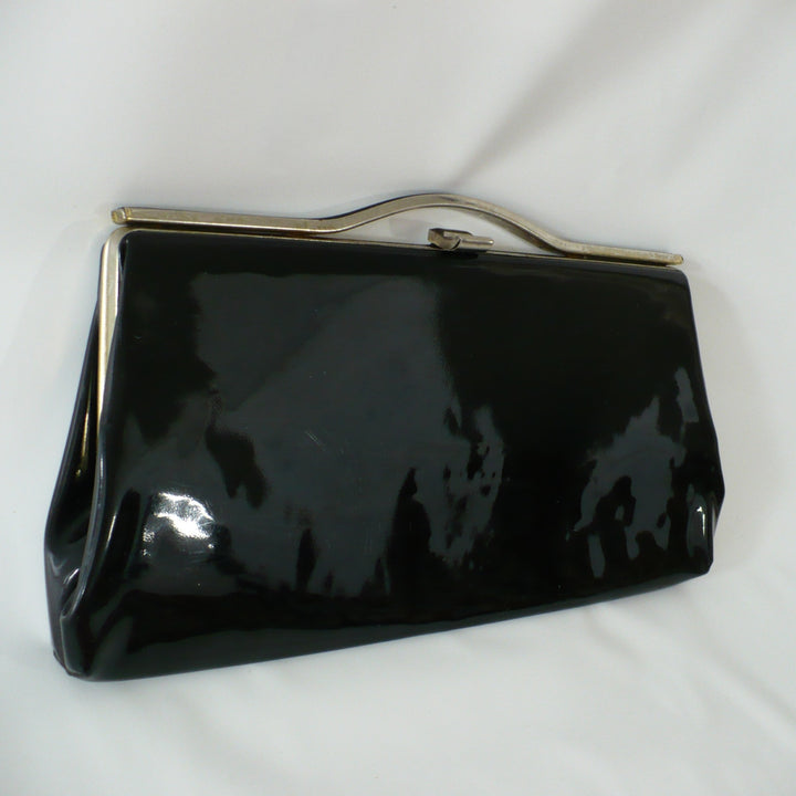 1964 Vintage Black Patent-look Cutout Handle Long Slender Handbag.