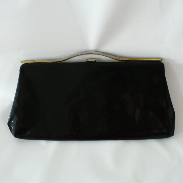 1964 Vintage Black Patent-look Cutout Handle Long Slender Handbag.
