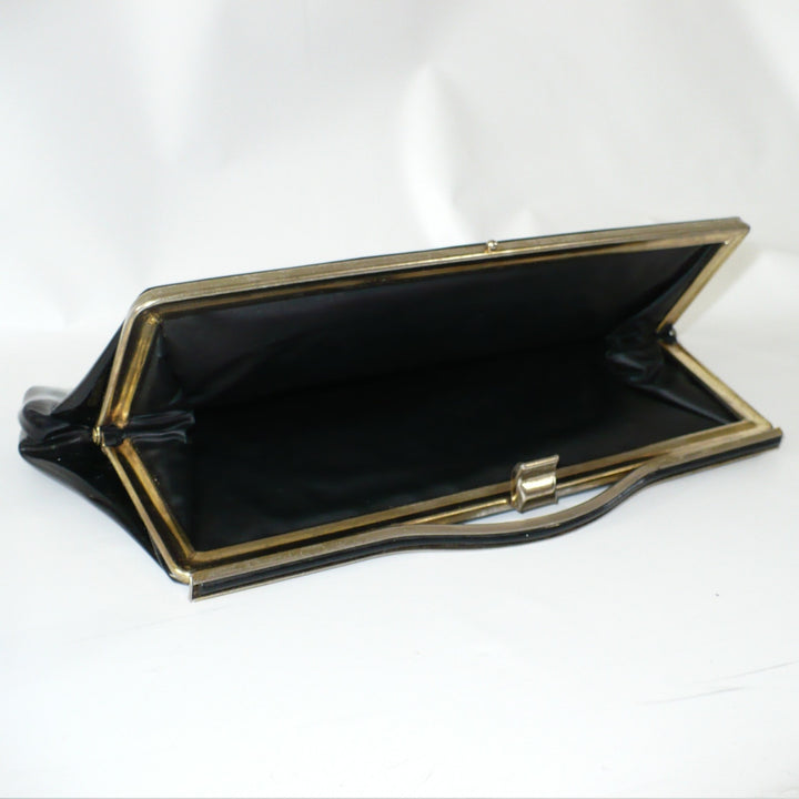 1964 Vintage Black Patent-look Cutout Handle Long Slender Handbag.