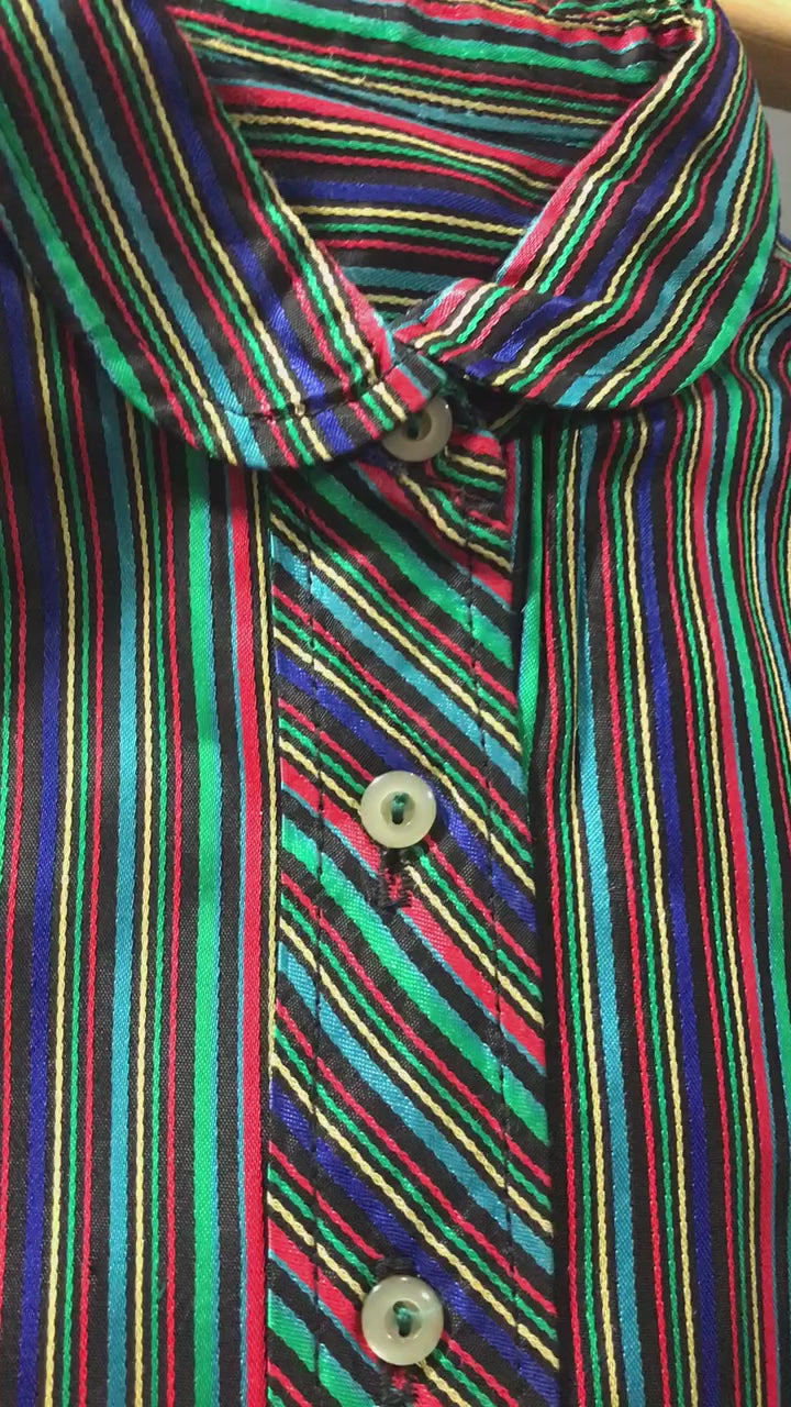 A close-up of the bodice that features the beauty of the woven satin and the richness of the narrow, jewel-tone colored stripes. Exhibits the superior quality of woven colors over flat, printed colors. Shows the superior quality construction of the dress  as well.