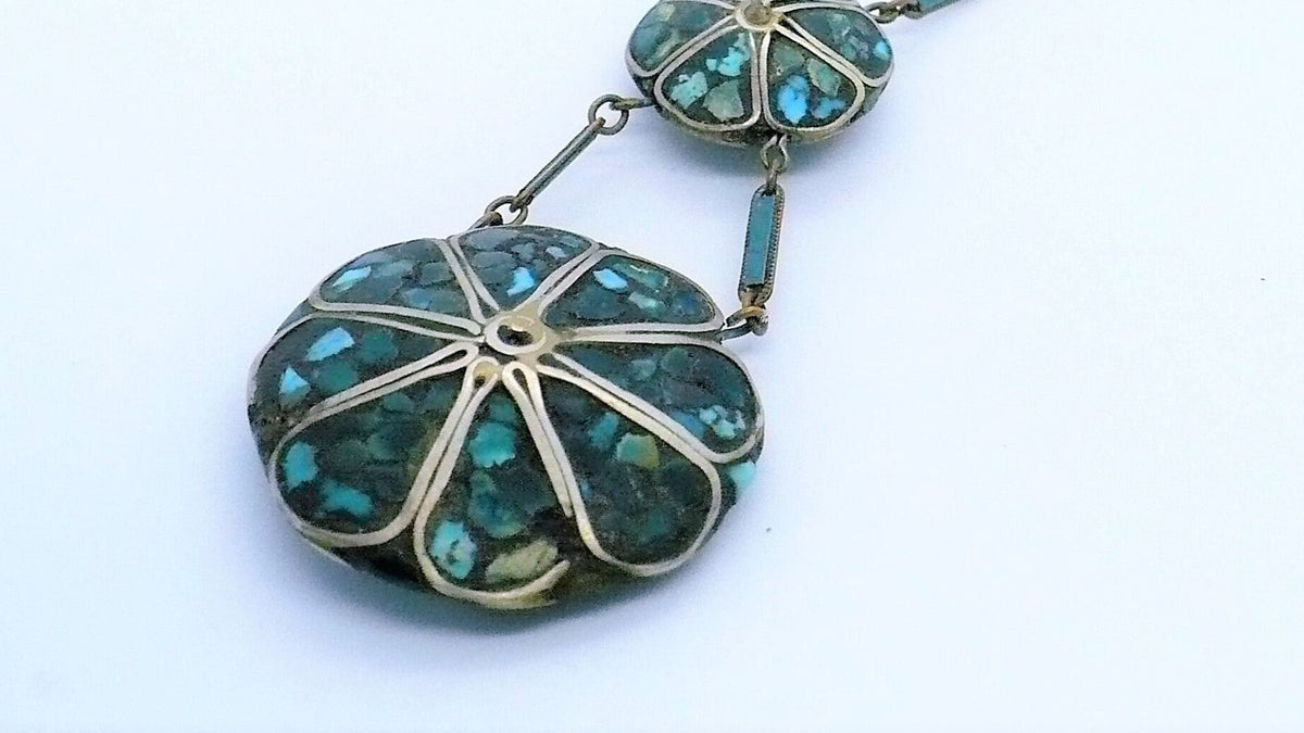 A close-up of an antique Kashmiri Ferozi turquoise necklace.