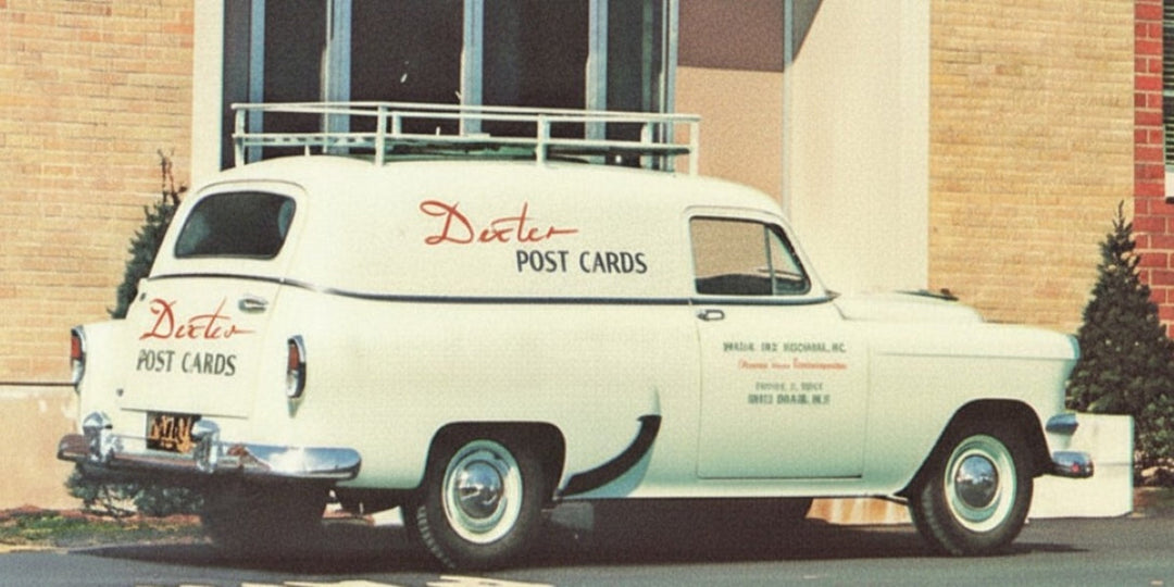 Dexter Press official automobile with logo written on the side of the car.