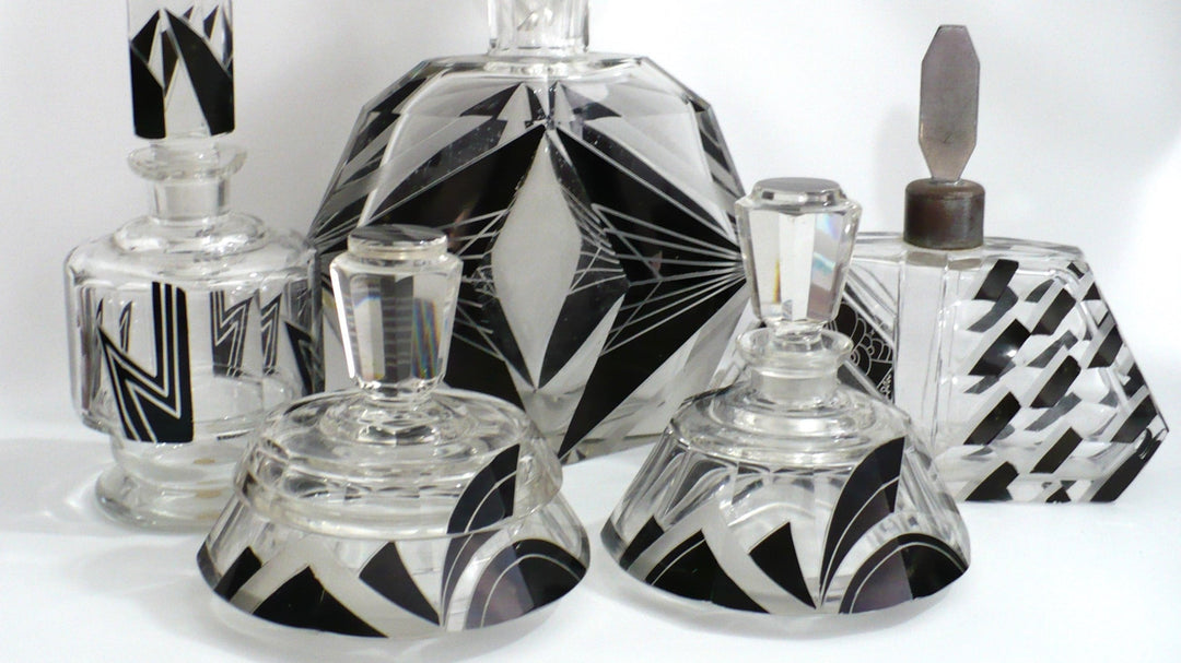 1930s Karl Palda Art Deco Bohemian glassware collection featuring modernist geometric enameled crystal and vanity accessories