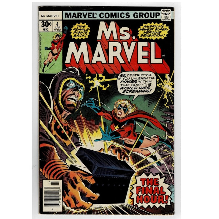 Vintage Marvel Comics Group Ms. Marvel issue #4 comic book cover, featuring a dramatic illustration of a hooded figure and Ms.