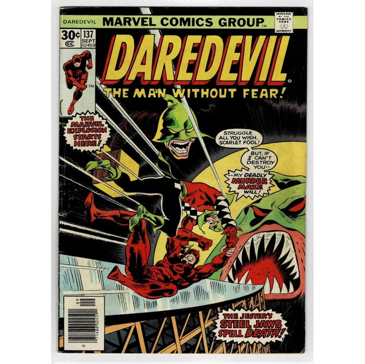Marvel Comics Group Daredevil issue 137 comic book cover, featuring the character Daredevil in red and black fighting a green monster with large red and white teeth, with bold yellow title text at the top.