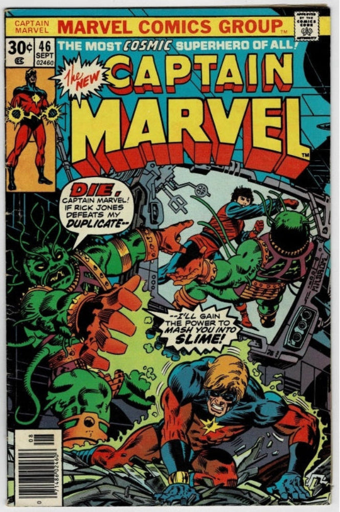 Vintage Captain Marvel comic book cover from Marvel Comics Group, issue 46, featuring a dynamic illustrated battle scene with the Captain Marvel character in the foreground and green slime monsters. The cover includes large title text, issue price, barcode, and comic-style artwork.