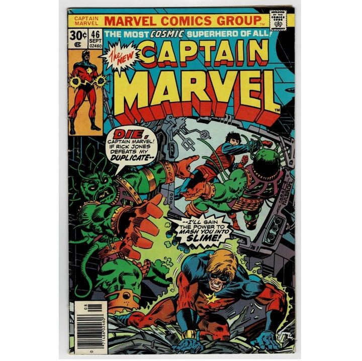 Vintage Marvel Comics Group Captain Marvel issue 46 comic book cover, featuring Captain Marvel in a blue and red suit with a yellow star emblem, surrounded by green and orange cosmic creatures in a dynamic illustrated battle scene.