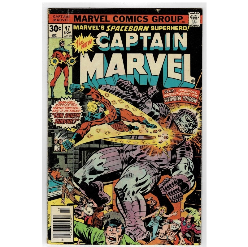 Vintage Marvel Comics Group comic book cover, Captain Marvel #47, featuring a dynamic illustrated battle scene with a large gray metallic creature and Captain Marvel in red and blue, with bold comic-style title text at the top.