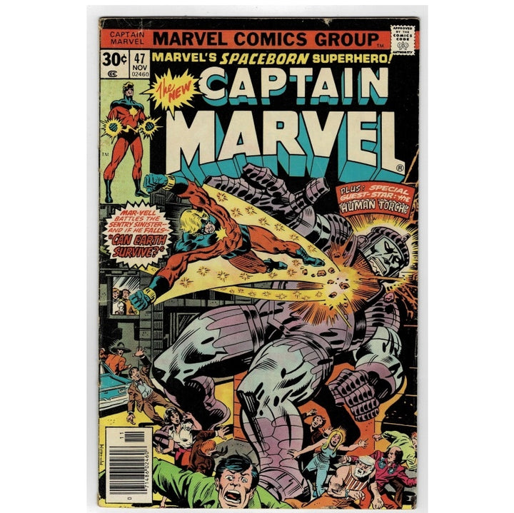 Vintage Marvel Comics Group comic book cover, Captain Marvel #47, featuring a dynamic illustrated battle scene with a large gray metallic creature and Captain Marvel in red and blue, with bold comic-style title text at the top.