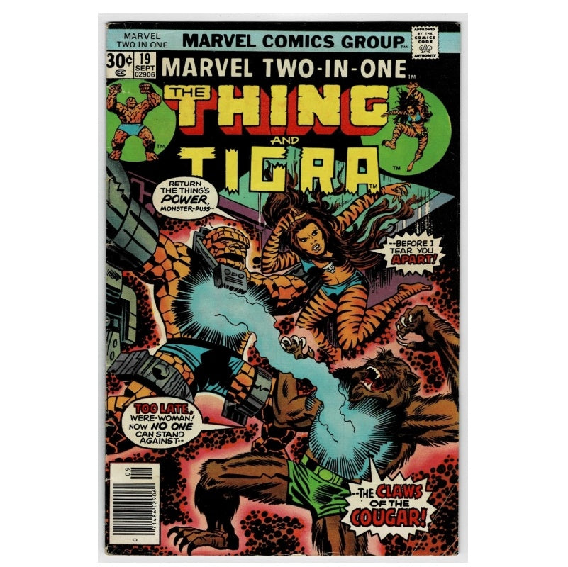 Marvel Two-In-One #19 comic book cover featuring The Thing and Tigra in an action scene with a cougar and a robotic creature. The cover has bold yellow title text and classic comic-style artwork.