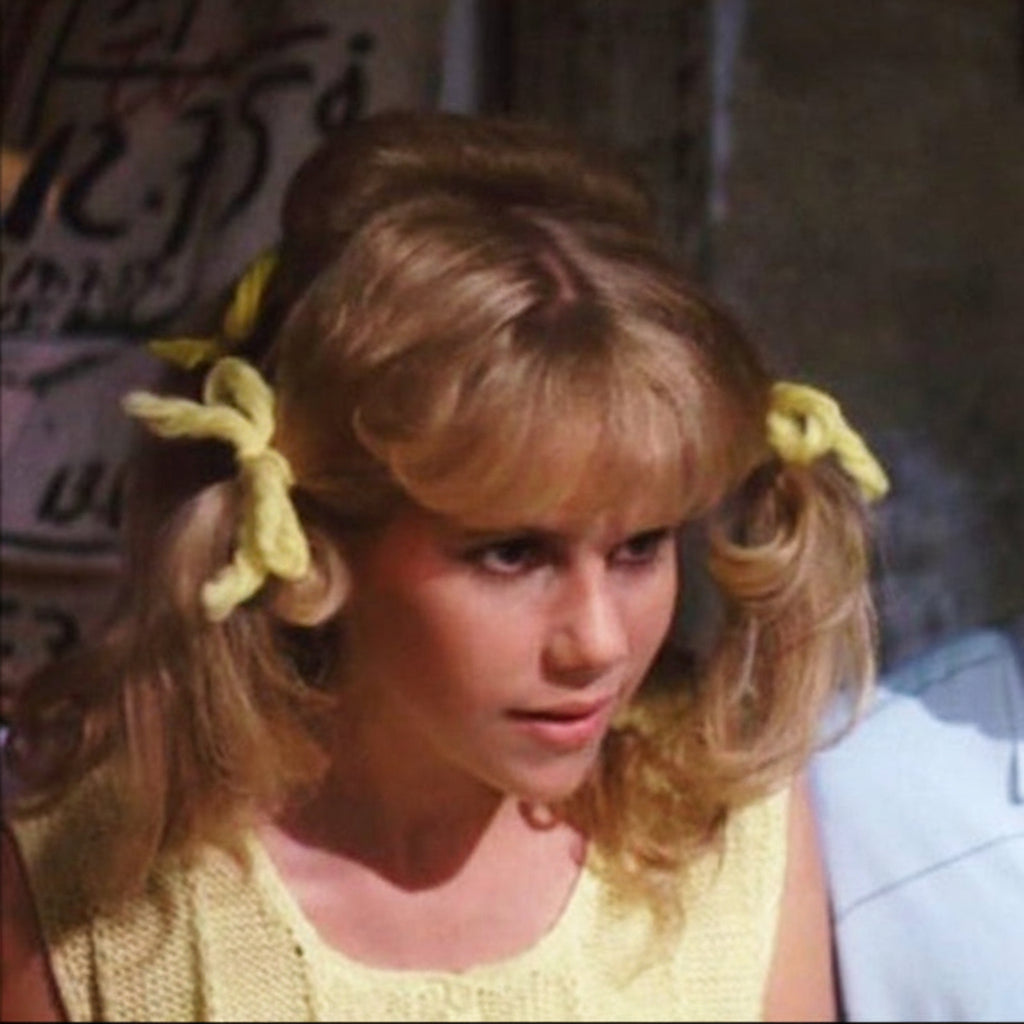 Penny Pingleton in Hairspray wearing vintage yarn hair ties.
