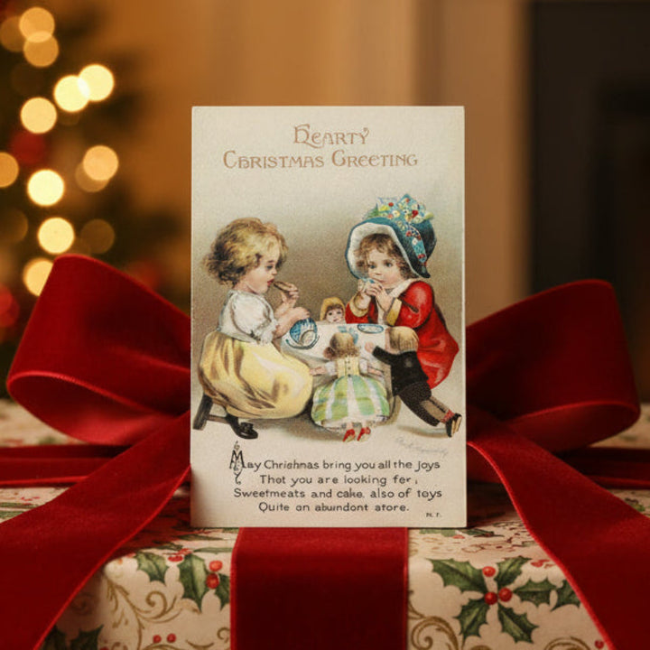 1915 Clapsaddle Christmas Tea Party Vintage Postcard Artist Signed shown as gift topper.
