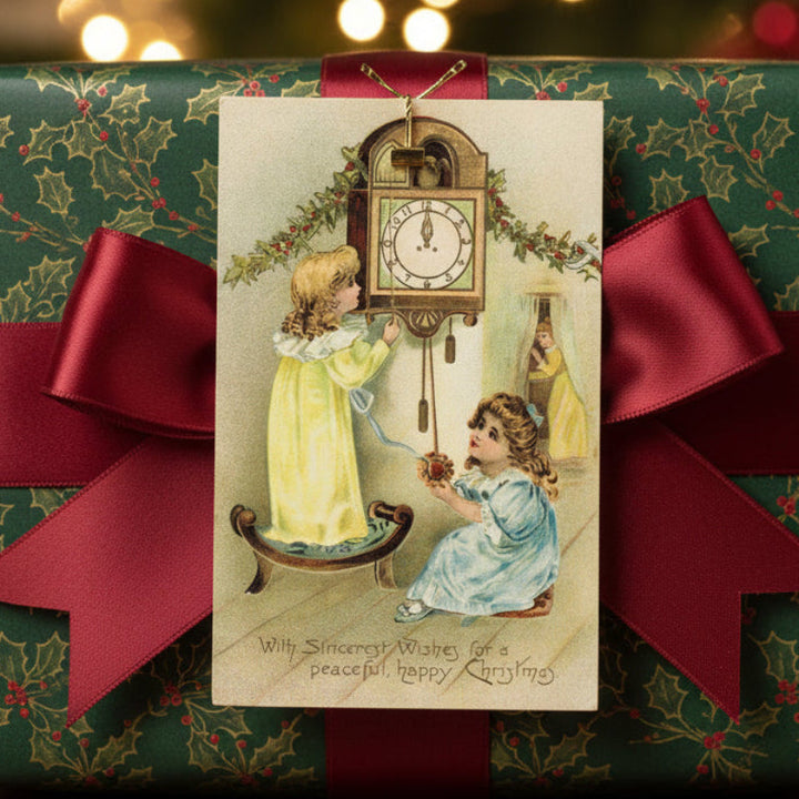 1907 Cuckoo-Cuckoo, It's Christmas! Vintage Christmas Postcard, shown as a gift topper.