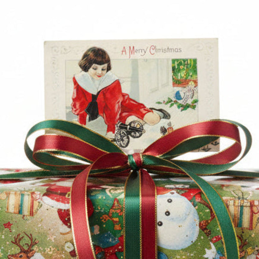 1915 Marching Into Christmas Boy With Toys Vintage Christmas Postcard used as a unique gift topper.