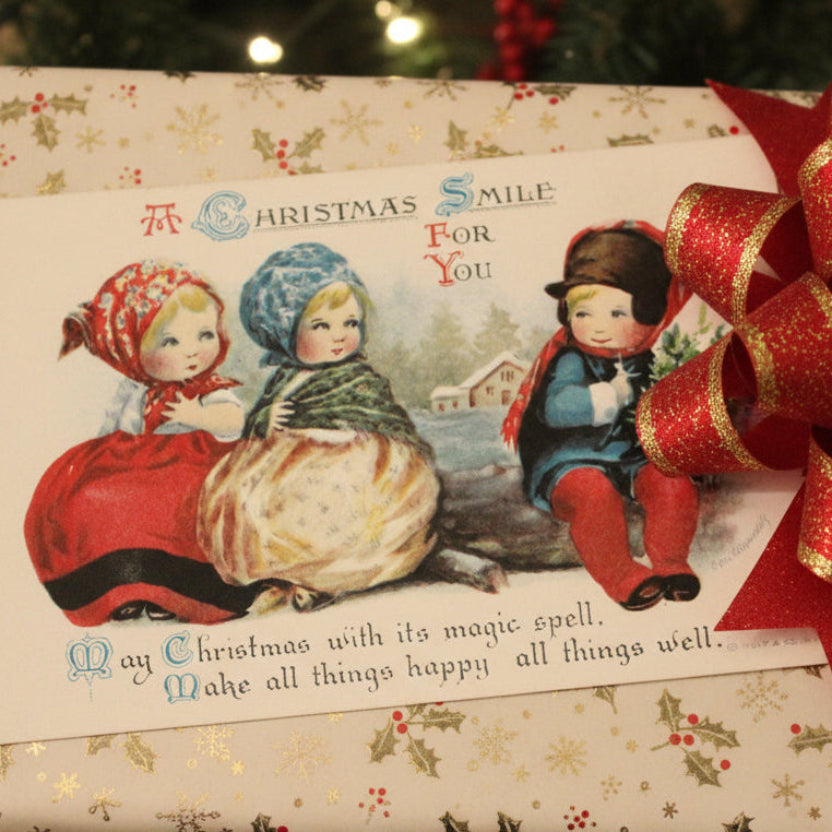 1909 A Christmas Smile by Clapsaddle Artist Signed Vintage Postcard used as OOAK gift topper.