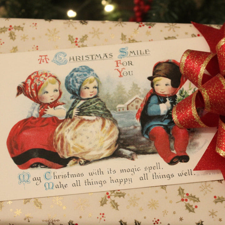 1909 A Christmas Smile by Clapsaddle Artist Signed Vintage Postcard used as OOAK gift topper.