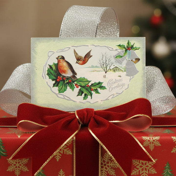 1911 Silver Bells and Songbirds Vintage Christmas Postcard as a gift topper.