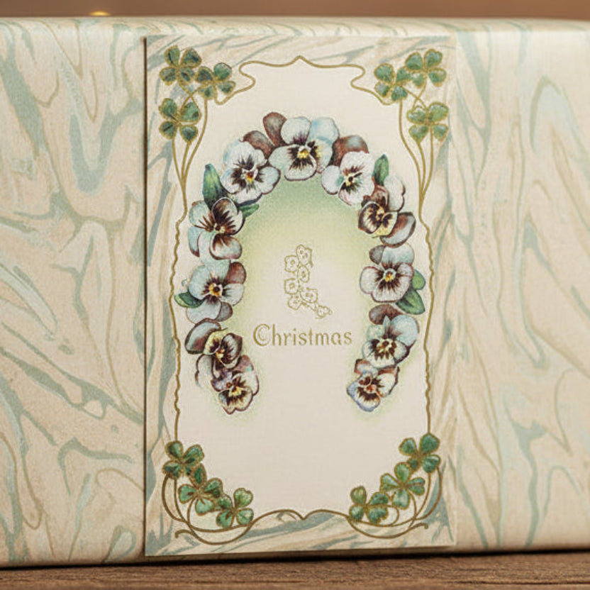 1911 Christmas Wishes with Irish Charm Vintage postcard,  shown as a gift topper.