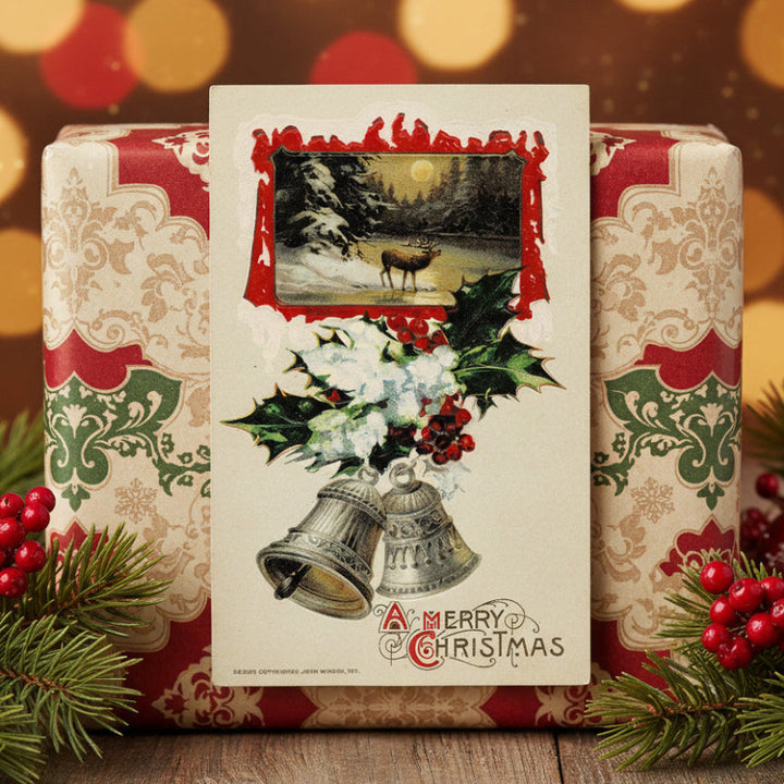 1911 Christmas Stag in Moonlit Snow by Winsch, shown as gift topper.