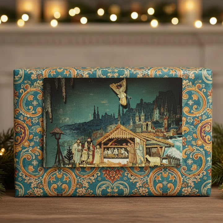 Decorative box with a festive design featuring Perpetual Nativity, Seven Dolors Shrine, Valparaiso IN, Vintage Postcard against a blurred background with lights.