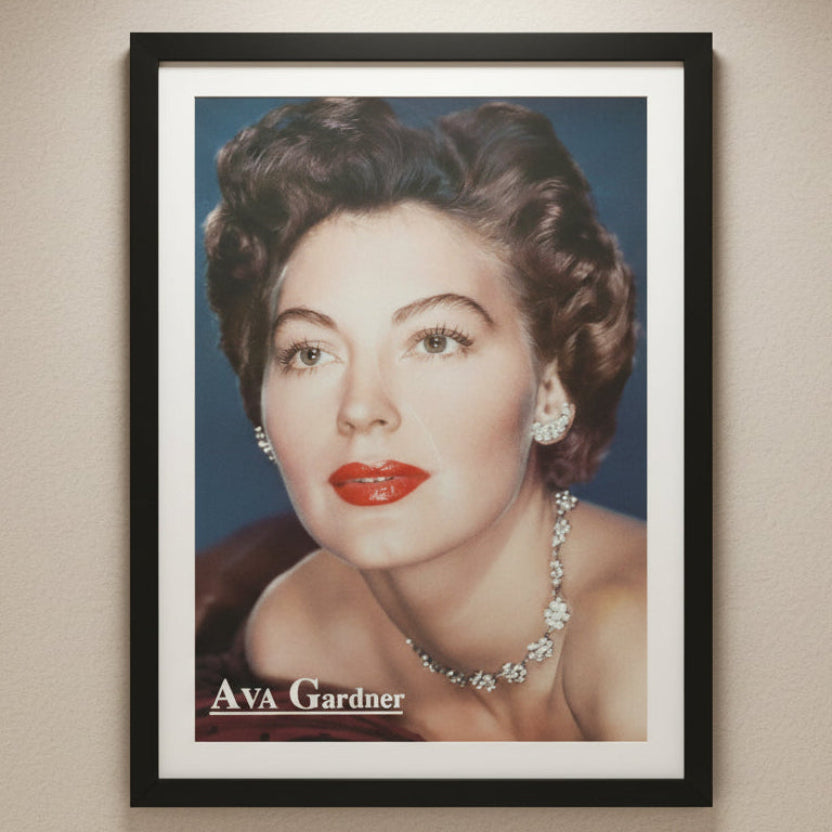 Framed centerfold poster of Ava Gardner on a beige wall for example of display idea.