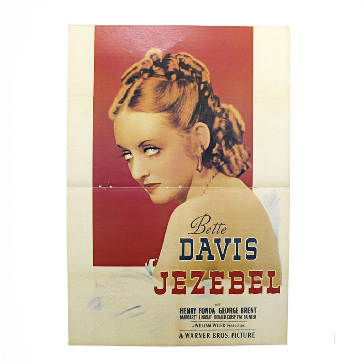 Vintage magazine centerfold movie poster for the 1935 Warner Bros. film 'Bette Davis as Jezebel', featuring a stylized portrait of Bette Davis against a red background with cream-colored paper borders and bold title text.