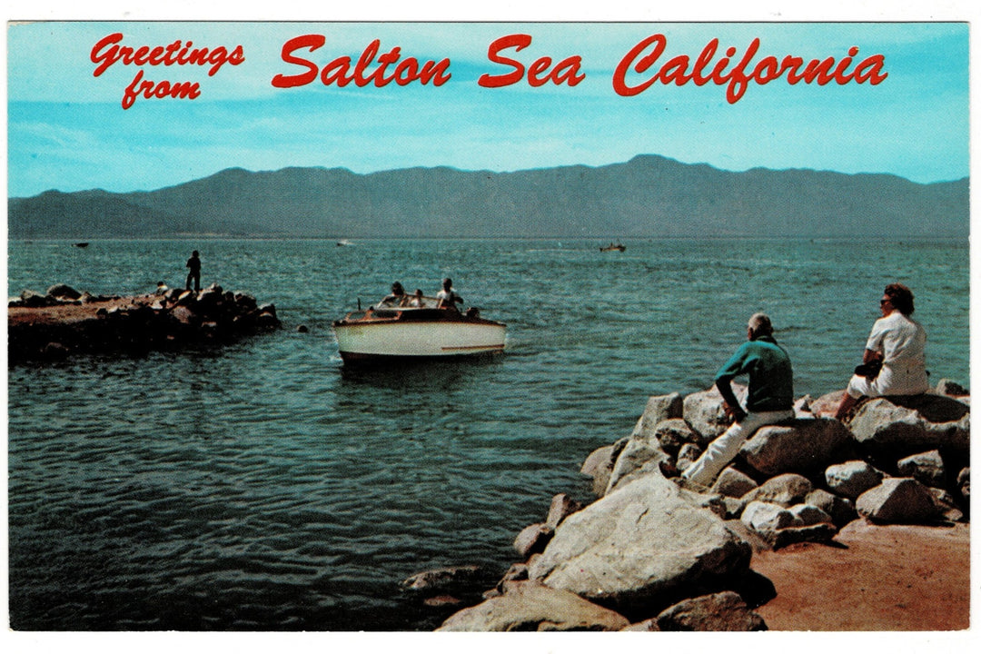 Vintage  postcard of Salton Sea, California with people by the water and mountains in the background.