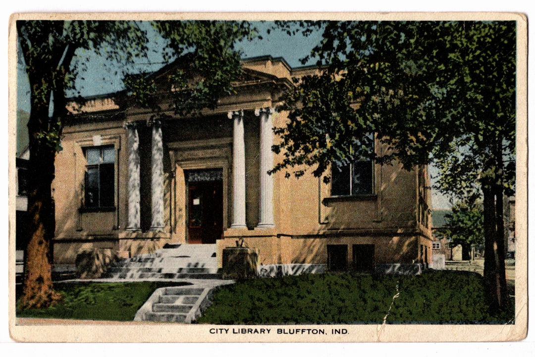 Vintage postcard of a city library building with columns and steps, Bluffton, Indiana.