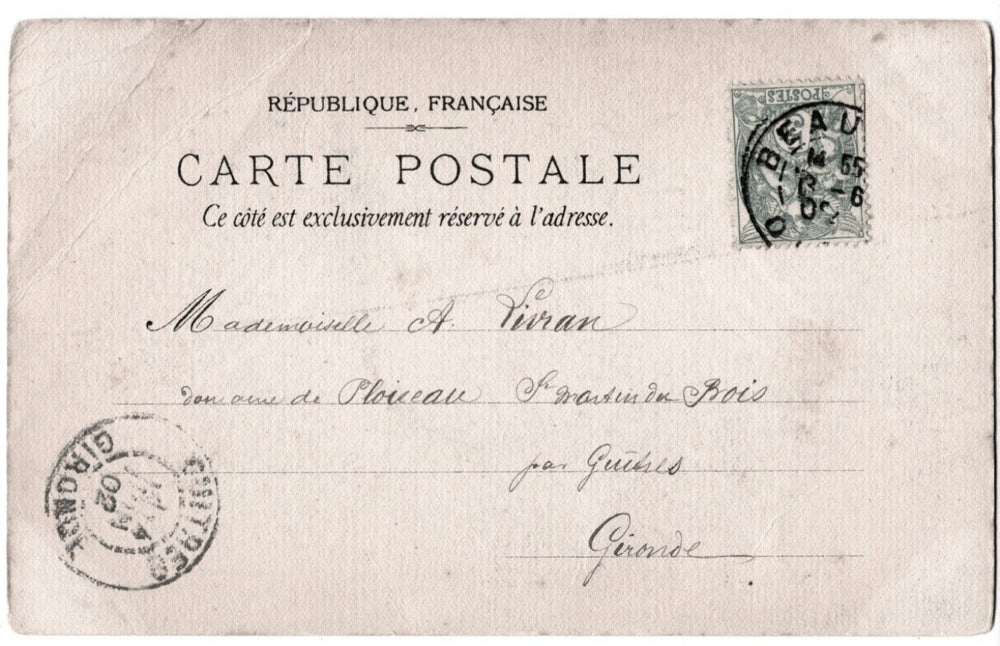 Vintage French postcard with stampsand text on a beige background
