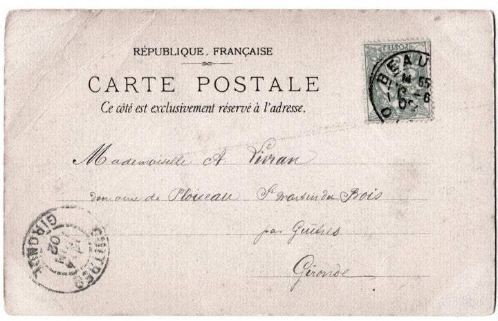 Vintage French postcard with stampsand text on a beige background