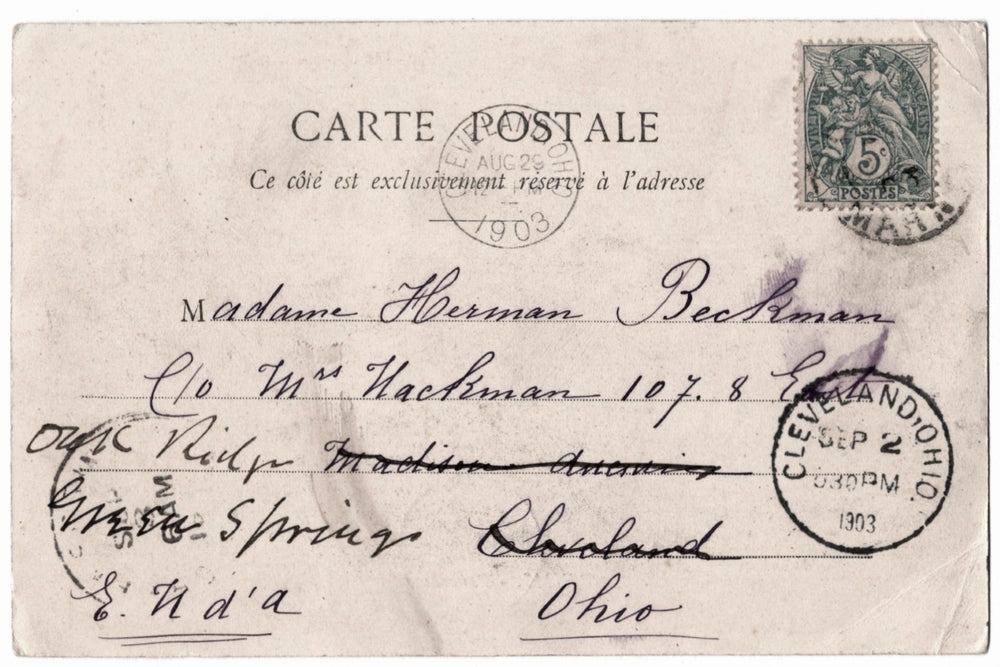 Vintage postcard with stamps and cursive writing, sent from Cleveland, Ohio in 1903.
