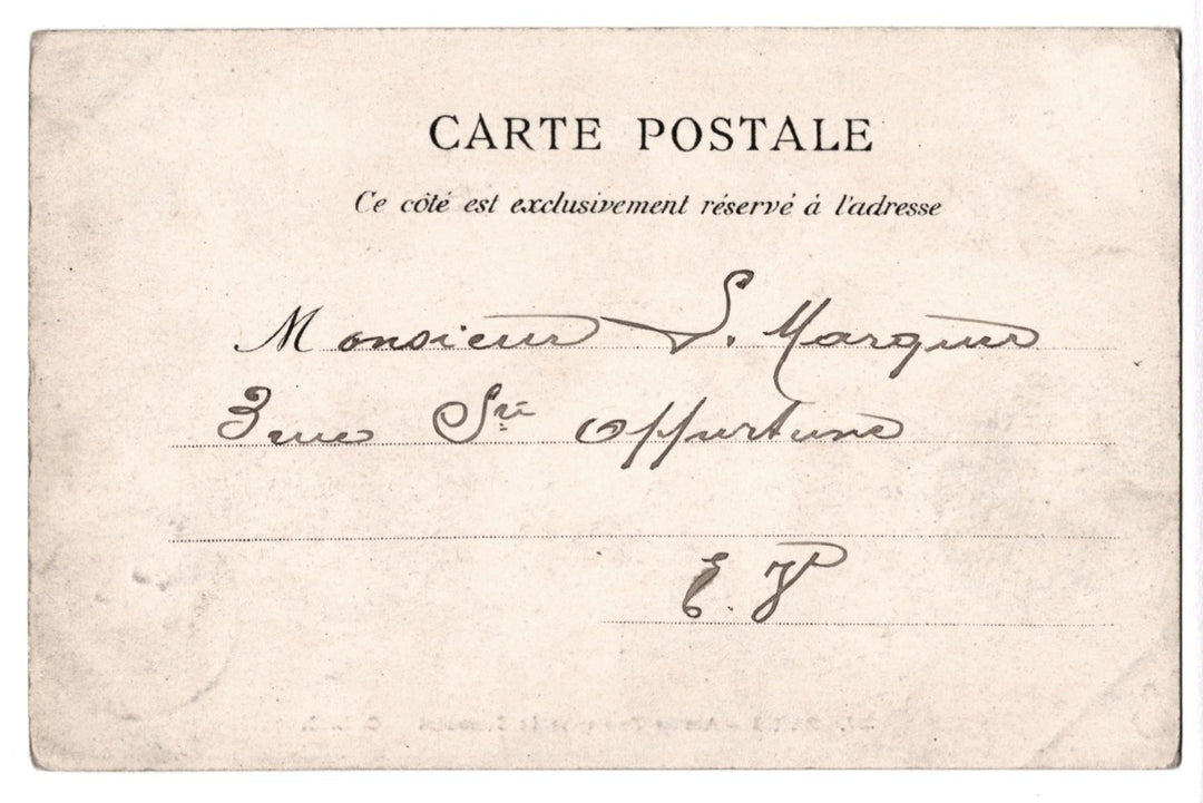 Vintage postcard with handwritten text on a beige background.