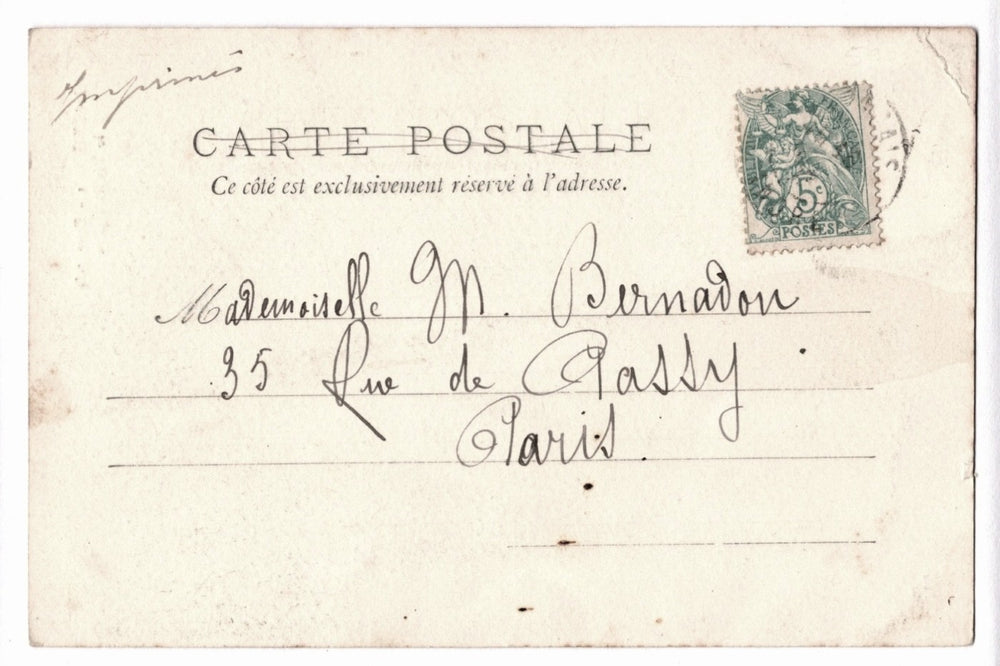 Vintage French postcard with stamp and handwritten address.