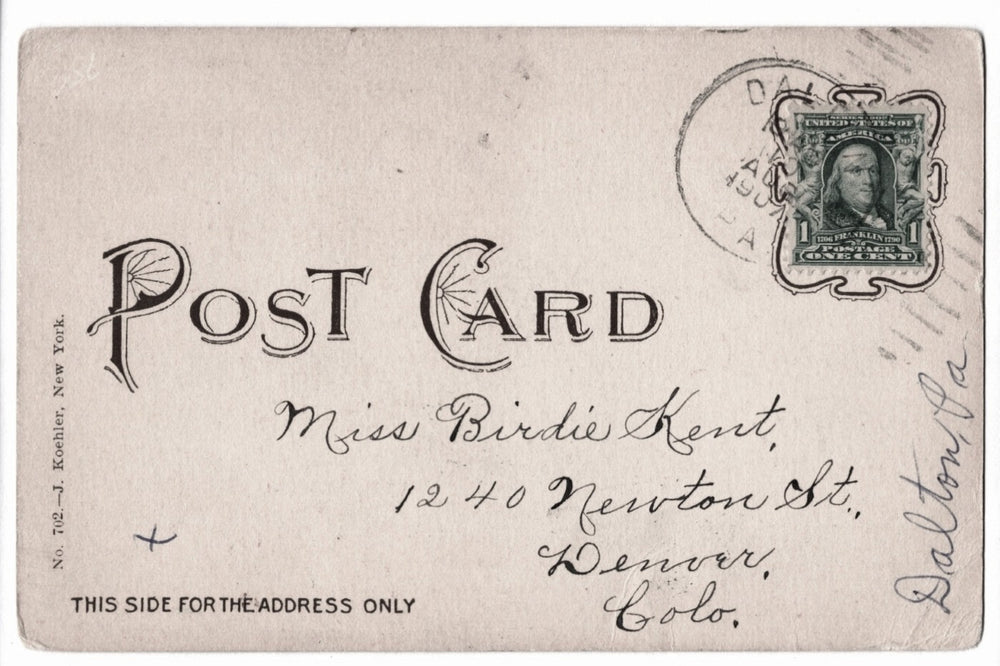 Vintage postcard with stamp and address text.