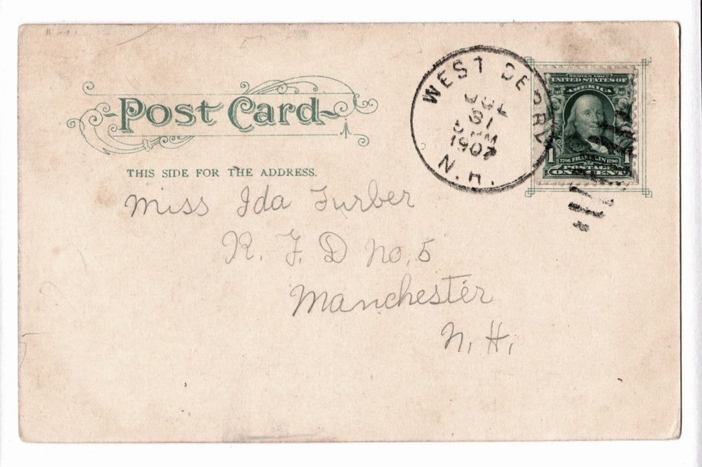 Vintage postcard with stamp and cursive writing.