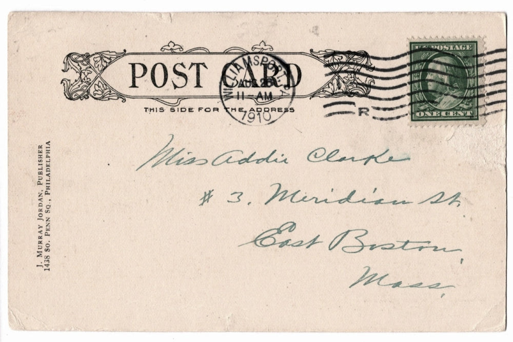 Vintage postcard with postage stamp and address.