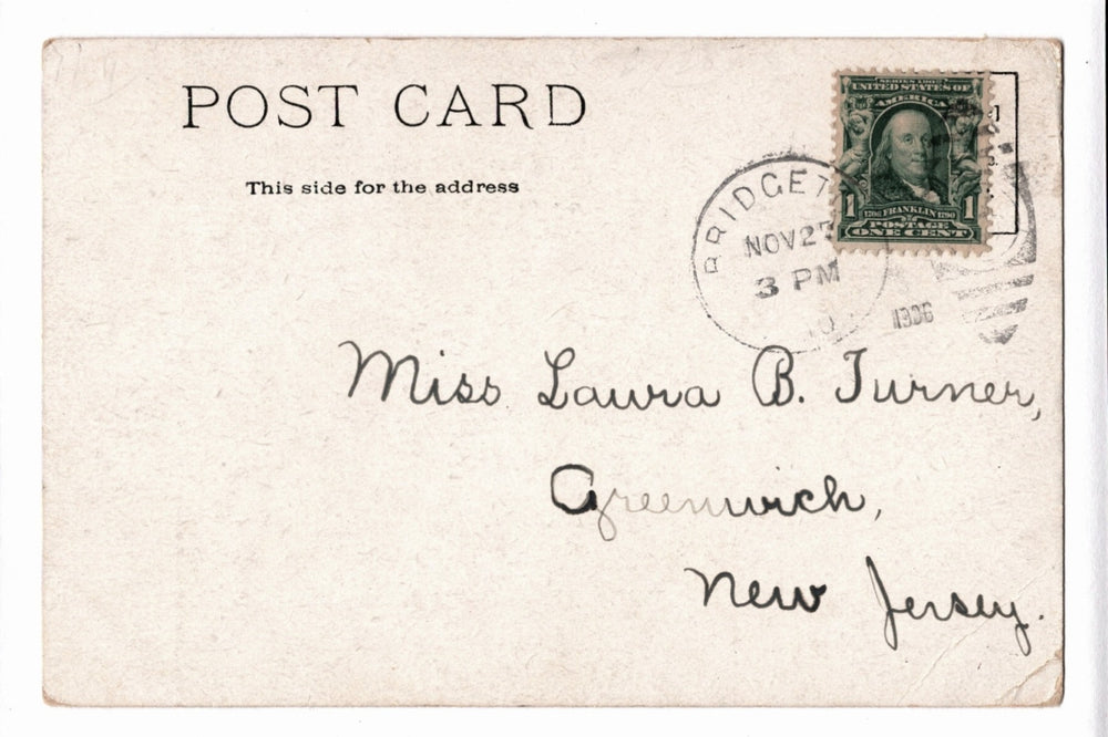 Vintage postcard with postage stamp and address text.